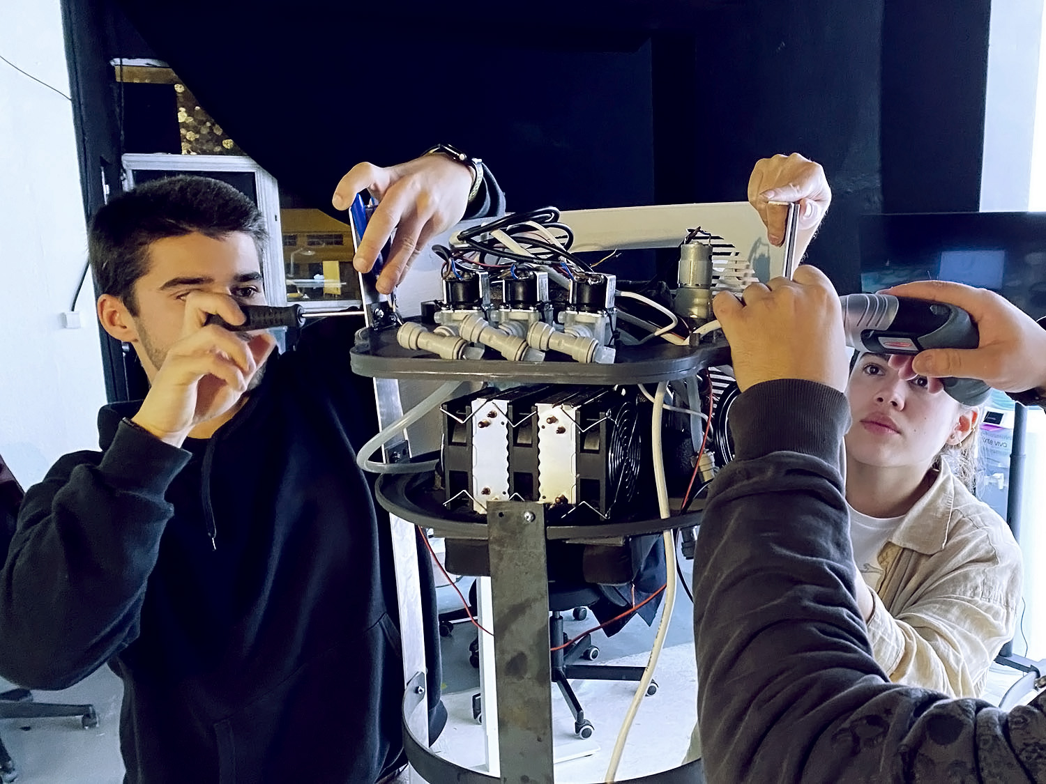 QL Industrial Team working on a prototype